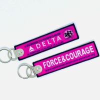 Porte clé "flamme" Delta Air Lines Vol Rose