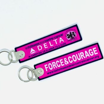 Porte clé "flamme" Delta Air Lines Vol Rose