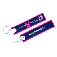**2024 - Porte clé "flamme NEW AIR FRANCE  OCTOBRE ROSE"