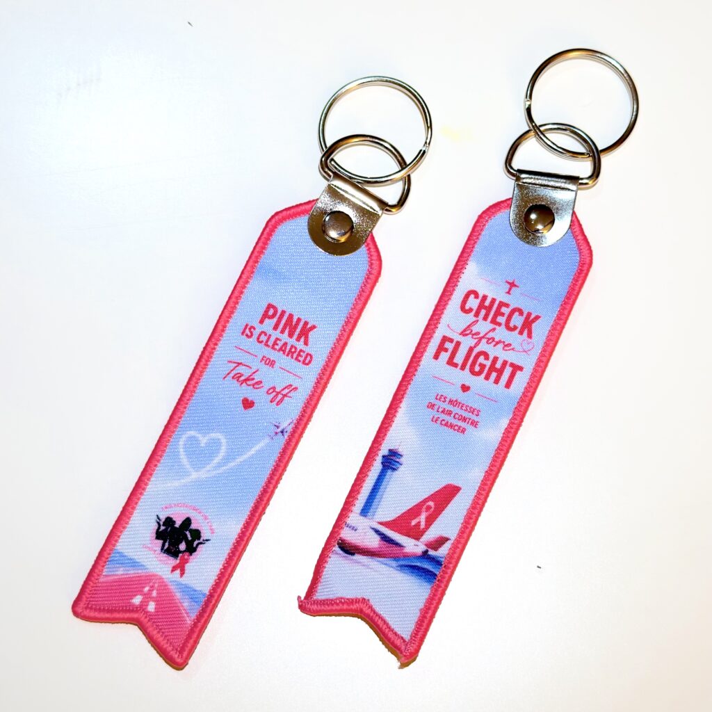 **2026** Porte clé "flamme HCC Check OCTOBRE ROSE 2026"